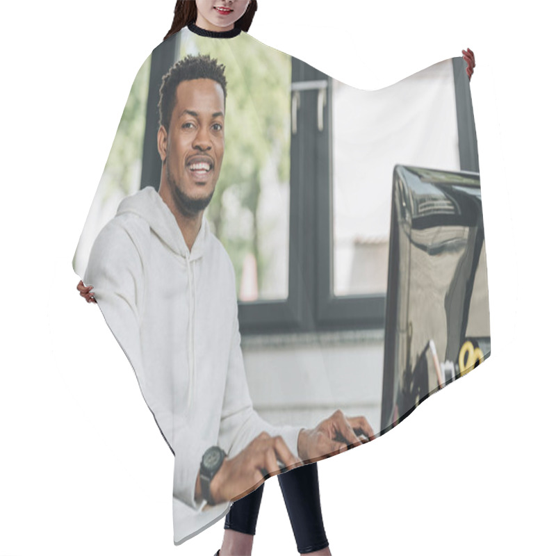 Personality  Cheerful African American Programmer Looking At Camera While Working On Computer In Office Hair Cutting Cape