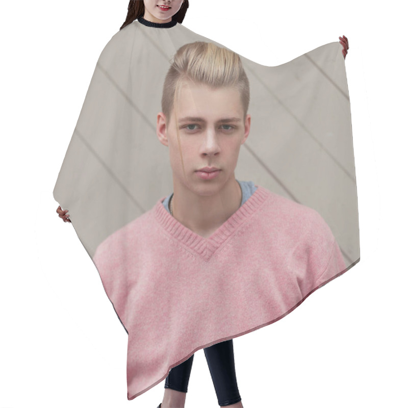 Personality  Handsome Young Man With A Hairstyle In A Pink Sweater Near A Wooden Wall Hair Cutting Cape