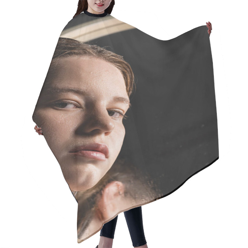 Personality  Young Model With Wet Skin On Face Looking At Camera Near Blurred Mirror  Hair Cutting Cape