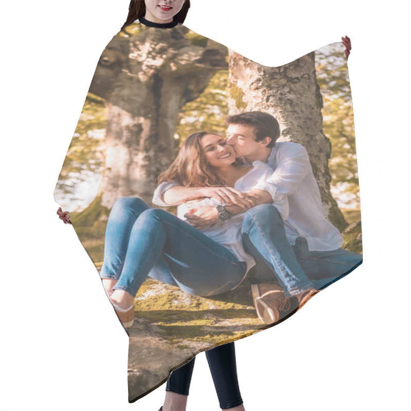 Personality  Vertical Photo Of A Young Man Embracing And Kissing His Girlfriend Sitting On The Forest Hair Cutting Cape