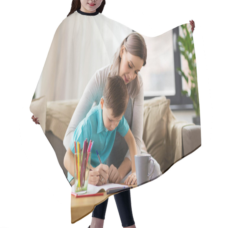 Personality  Mother And Son With Workbook At Home Hair Cutting Cape