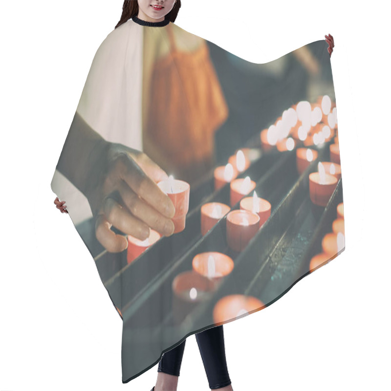 Personality  Woman Puts A Candle On Altar In Church. Hair Cutting Cape