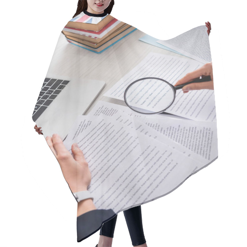 Personality  Partial View Of Translator Holding Magnifier Above Documents Near Laptop And Dictionaries Of Foreign Languages Hair Cutting Cape