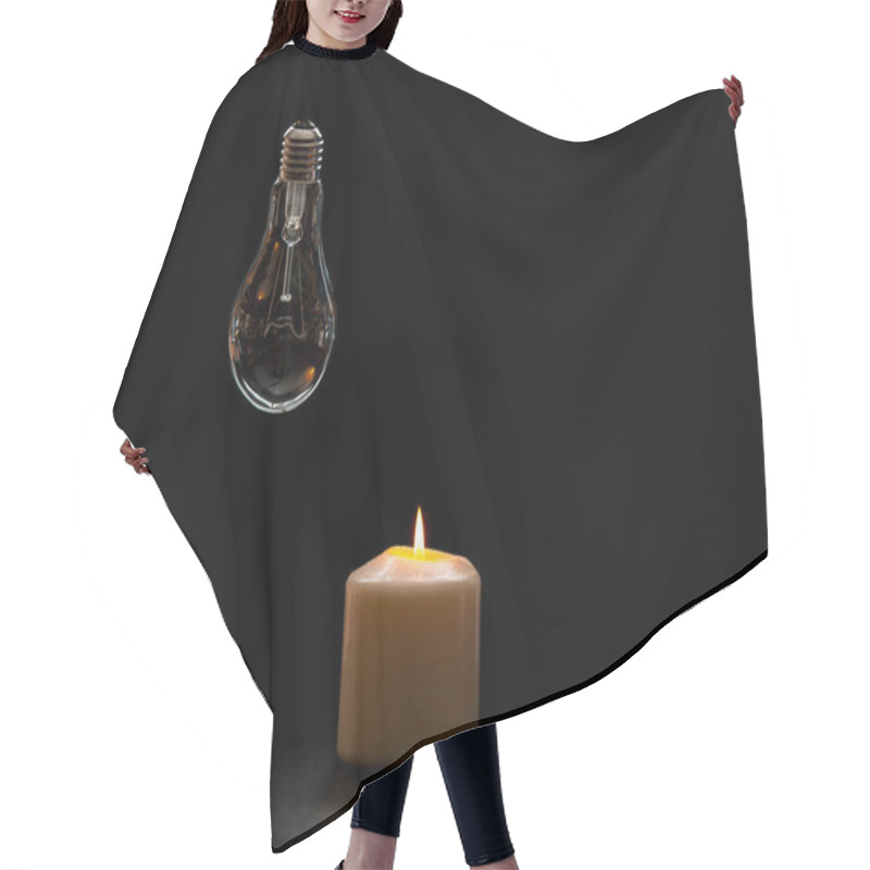 Personality  Burning Candle Near A Switched Off Light Bulb In Dark Home. Blackout, Electricity Off, Load Shedding Energy Crisis Or Power Outage, Concept Image. Hair Cutting Cape