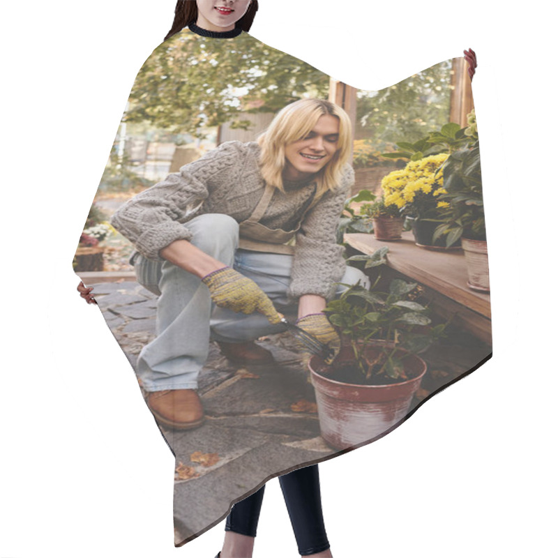 Personality  A Young And Stylish Person Kneels Down To Carefully Nurture A Potted Plant In A Charming Garden. The Surroundings Are Full Of Blooming Flowers And Greenery, Creating A Serene Atmosphere. Hair Cutting Cape