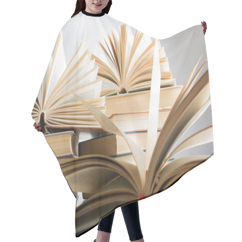 Personality  Books. Back To School. Composition With Hardback Books On The Table. Open Book, Fanned Pages. Copy Space. Education Background. Hair Cutting Cape