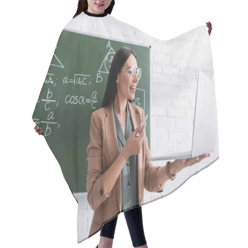 Personality  Teacher Having Online Lesson On Laptop Near Math Formulas On Chalkboard  Hair Cutting Cape