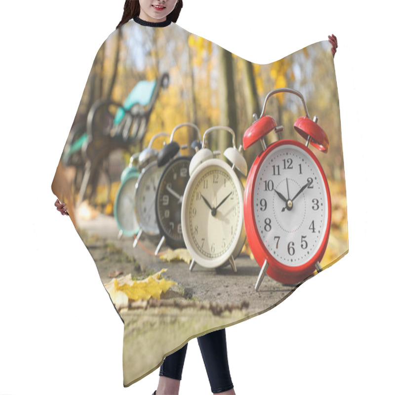 Personality  Alarm Clocks On Paved Pathway In Park At Autumn Hair Cutting Cape