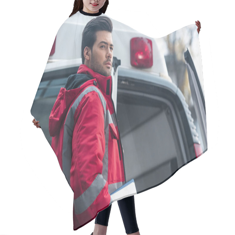 Personality  Serious Handsome Male Paramedic Standing And Looking Away Hair Cutting Cape