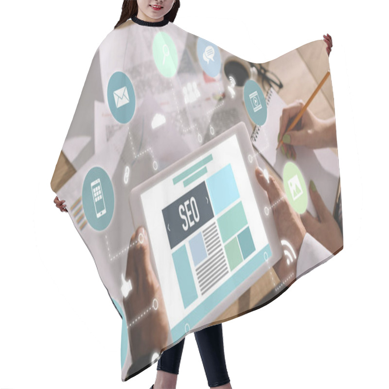 Personality  Developers Using Digital Tablet With SEO Symbols And Icons Hair Cutting Cape