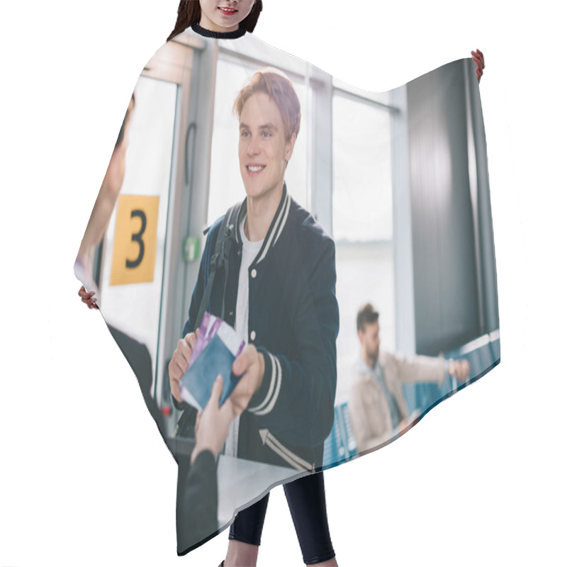 Personality  Cropped Shot Of Smiling Man Giving Passport To Airport Staff Hair Cutting Cape