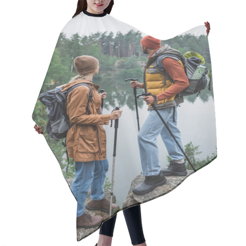 Personality  Back View Of Couple With Backpacks Holding Hiking Sticks And Looking At Lake Hair Cutting Cape