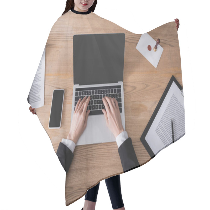 Personality  Top View Of Cropped Lawyer Typing On Laptop Near Smartphone With Blank Screen And Contract Hair Cutting Cape