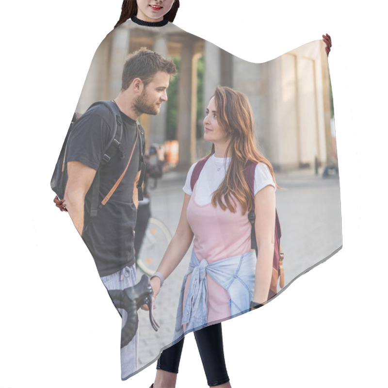 Personality  Couple Of Tourists With Backpacks Looking At Each Other At Pariser Platz, Berlin, Germany  Hair Cutting Cape