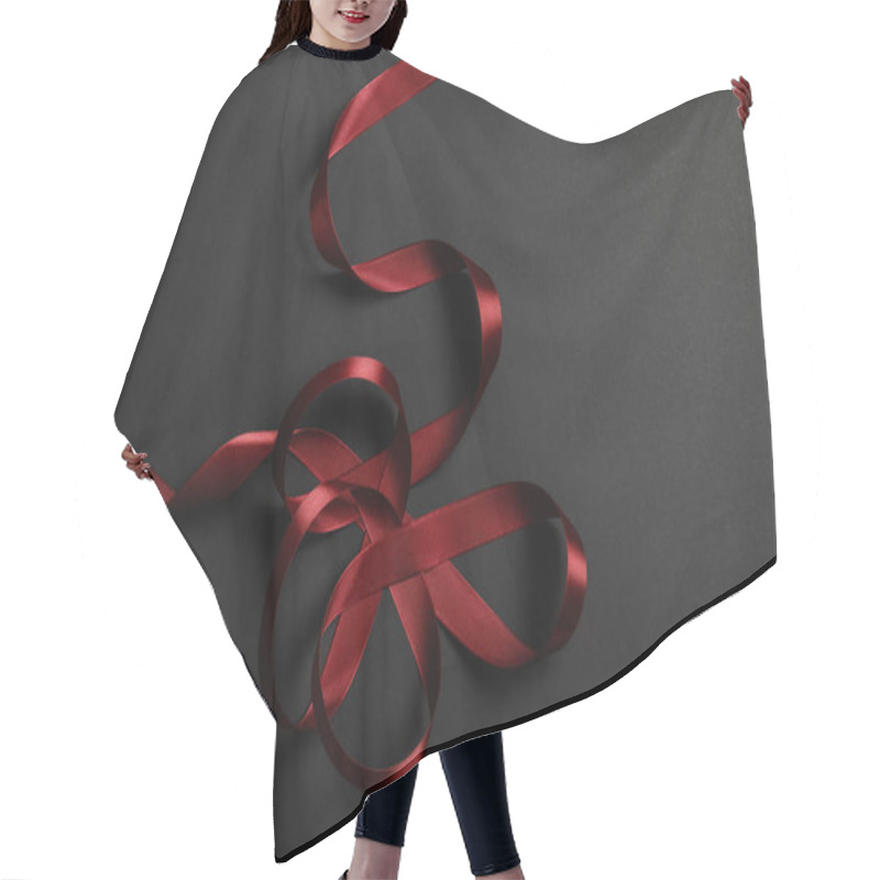 Personality  Top View Of Red Satin Wavy Ribbon On Black Background With Copy Space Hair Cutting Cape