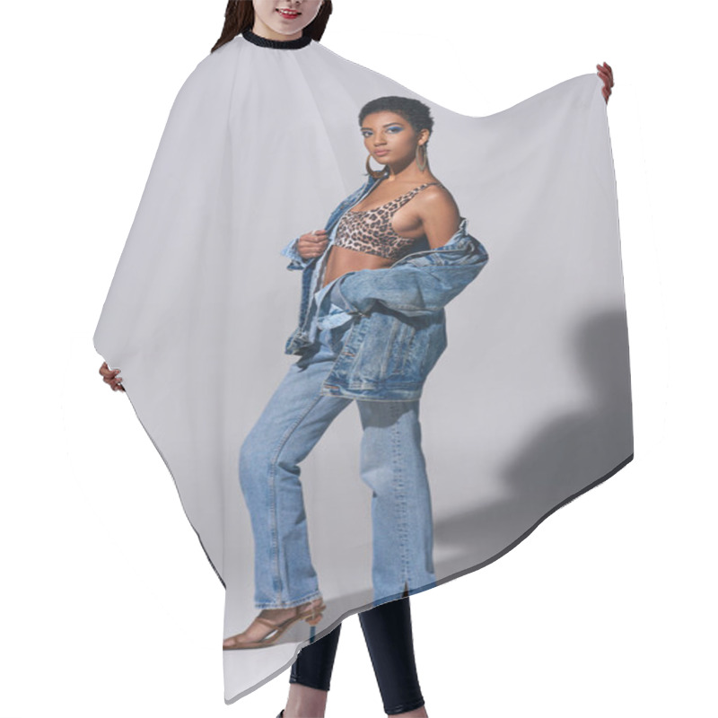 Personality  Full Length Of Fashionable African American Woman With Bold Makeup Wearing Top With Animal Print, Denim Jacket And Jeans On Grey Background, Denim Fashion Concept Hair Cutting Cape