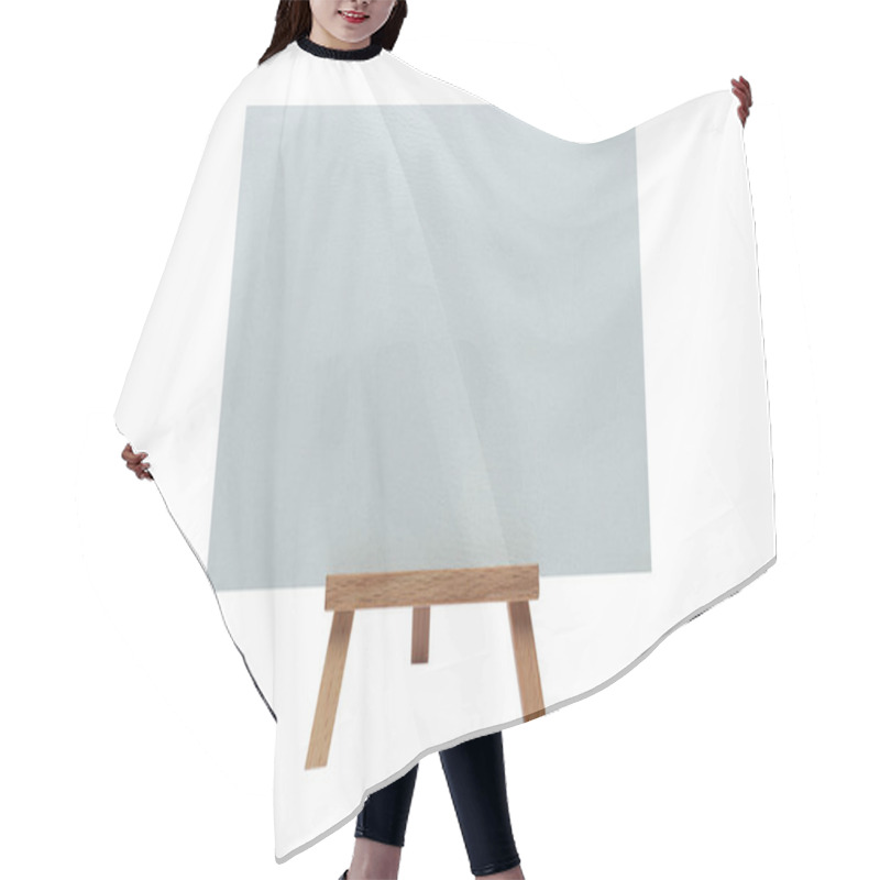 Personality  Clean Canvas On An Easel On An Isolated White Background. Hair Cutting Cape