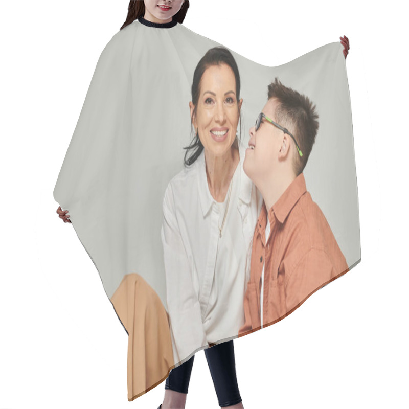 Personality  Middle Aged Woman Smiling Near Joyful Son With Down Syndrome On Grey, Disability Acceptance Hair Cutting Cape