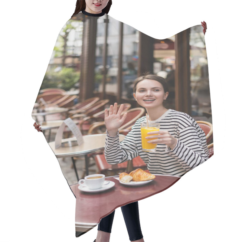 Personality  Happy Woman In Striped Long Sleeve Shirt Holding Glass Of Orange Juice And Waving Hand In Outdoor Cafe In Paris Hair Cutting Cape