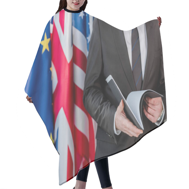 Personality  Cropped View Of Diplomat Holding Folder Near Flags  Hair Cutting Cape