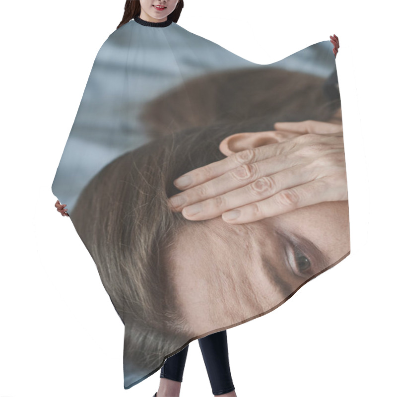 Personality  A Middle-aged Woman Laying On A Bed, Holding Her Head In Distress. Hair Cutting Cape