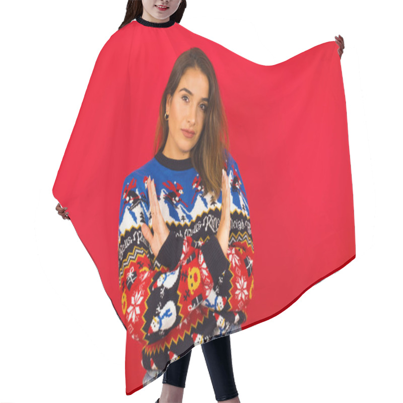 Personality  Caucasian Woman Wearing Christmas Sweater Against Red Wall Has Rejection Angry Expression On Face And Crossing Hands Doing Refusal Negative Sign. Hair Cutting Cape