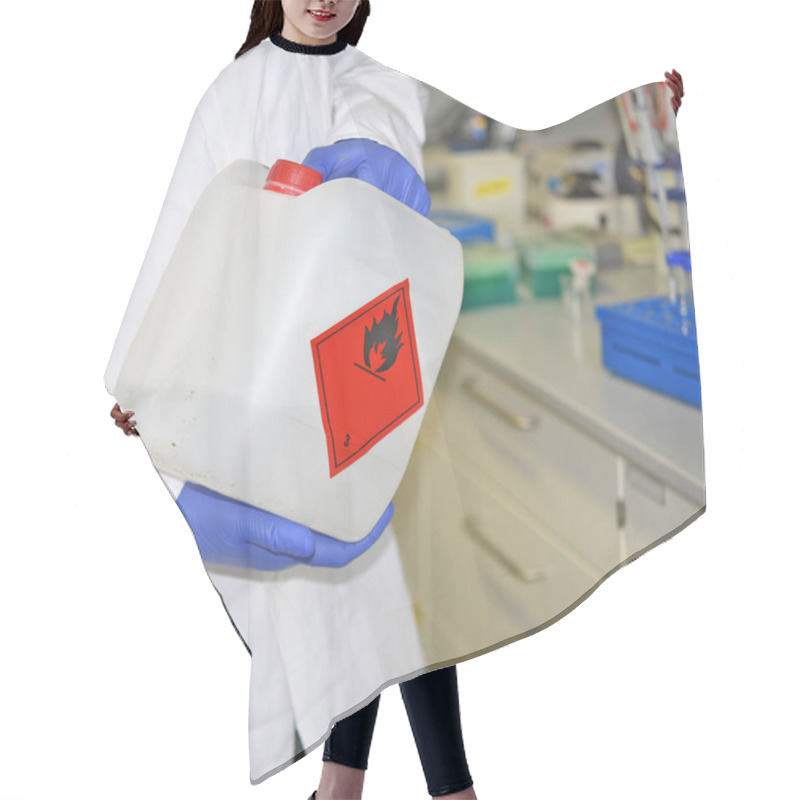 Personality  An Employee At A Biochemical Laboratory Works With Flammable Liquid In A Plastic Canister With Appropriate Marking Near The Working Surface In The Laboratory. Hair Cutting Cape