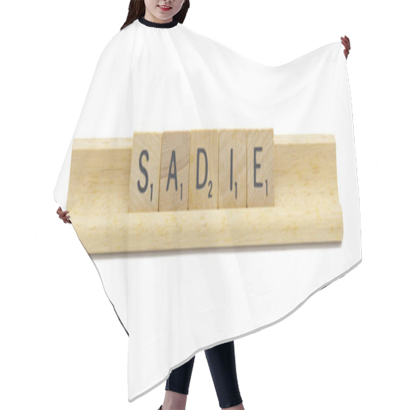 Personality  Miami, FL 4-18-24 Popular Baby Girl First Name Of SADIE Made With Square Wooden Tile English Alphabet Letters With Natural Color And Grain On A Wood Rack Holder Isolated On White Background Hair Cutting Cape