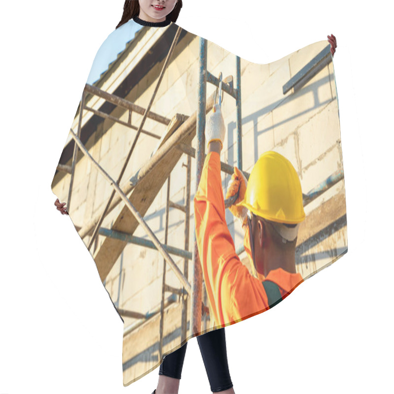 Personality  Construction Worker Wearing Safety Harness Belt During Working At High Place,Concept Of Residential Building Under Construction. Hair Cutting Cape