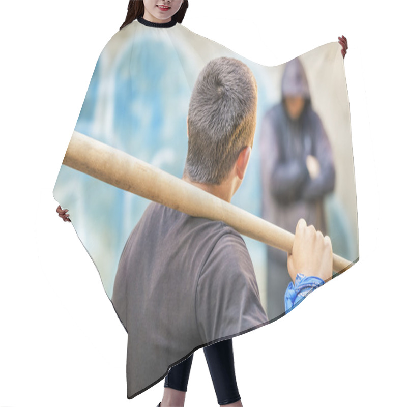 Personality  Aggressive Teenager With A Baseball Bat Against Man At Outdoor Hair Cutting Cape