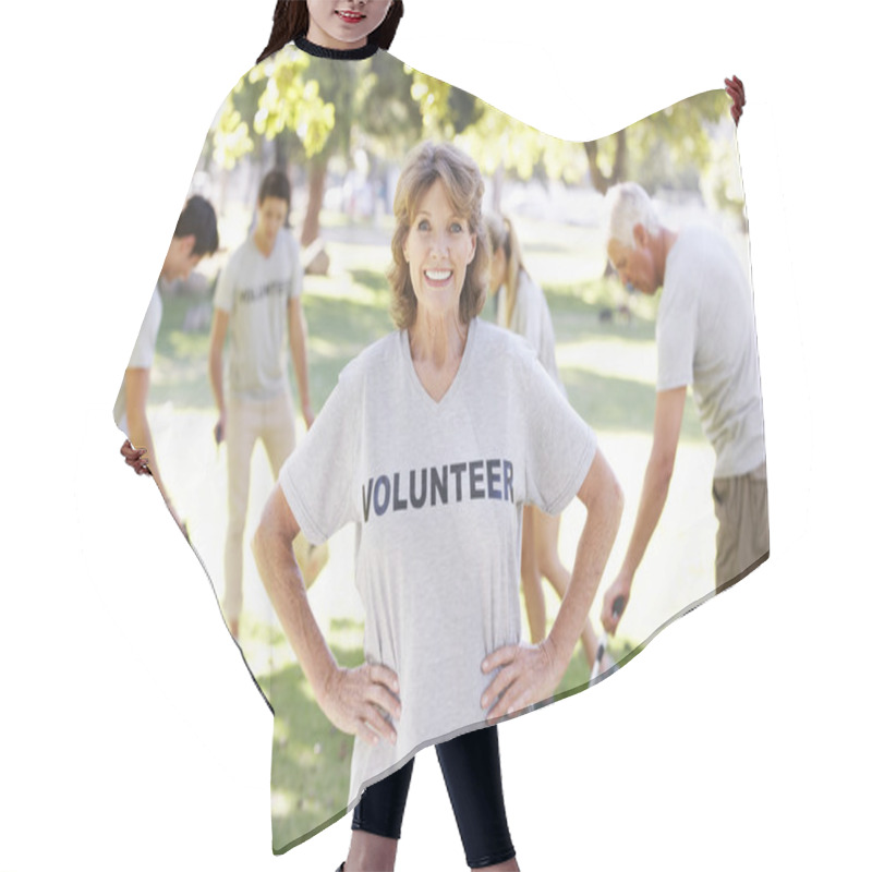 Personality  Female Volunteer Looking At Camera Hair Cutting Cape