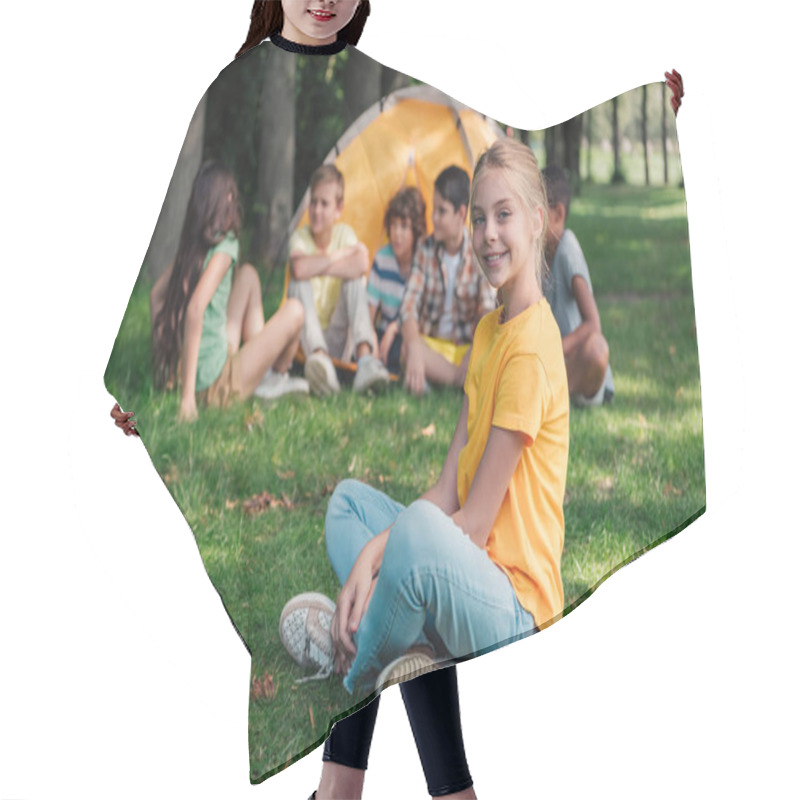 Personality  Selective Focus Of Happy Child Smiling Near Multicultural Friends In Camp  Hair Cutting Cape