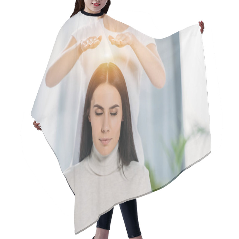 Personality  Peaceful Young Woman With Closed Eyes Receiving Reiki Healing Therapy Above Head  Hair Cutting Cape