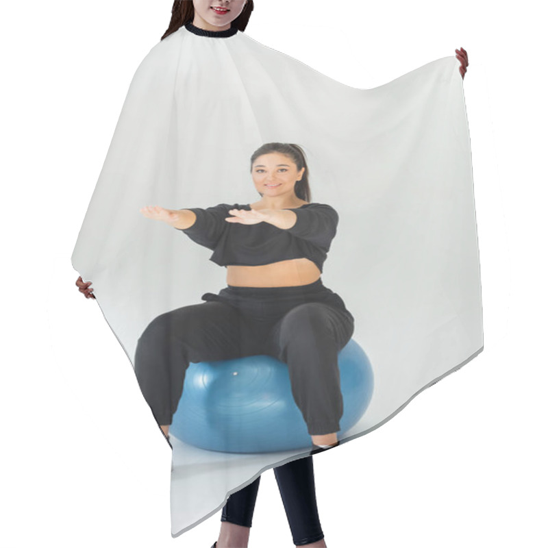 Personality  A Fit Woman Engages In A Dynamic Workout Session Using A Stability Ball For Strength Training. Hair Cutting Cape