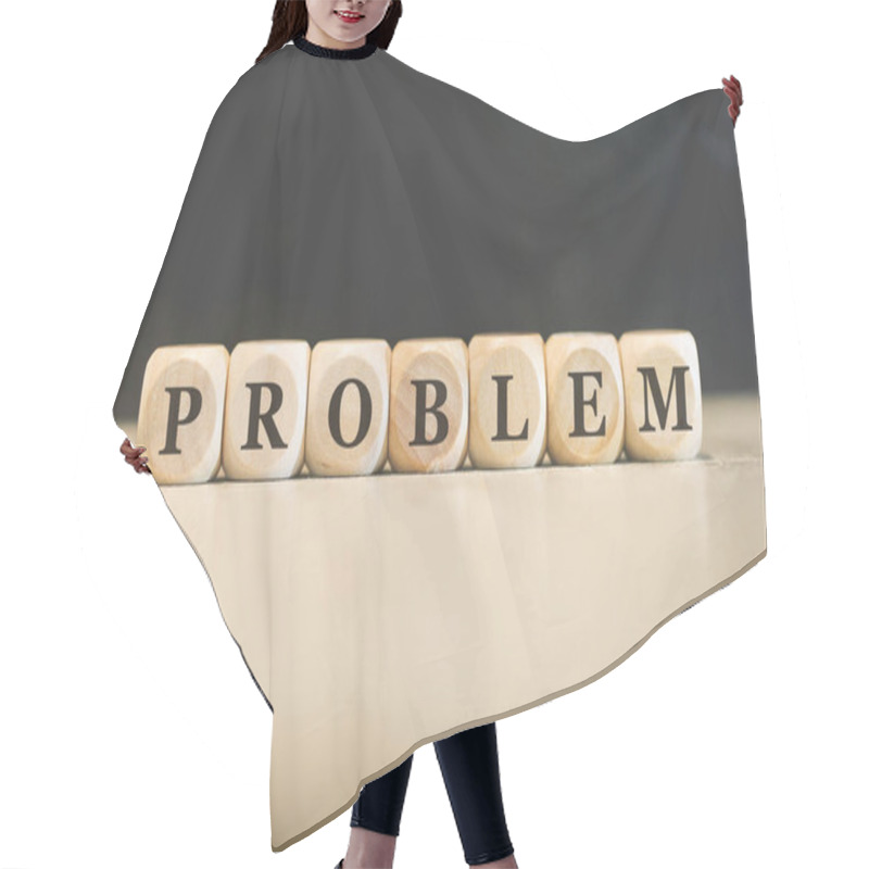 Personality  Inscription PROBLEM Written On Wooden Cubes. Black Background.  Hair Cutting Cape