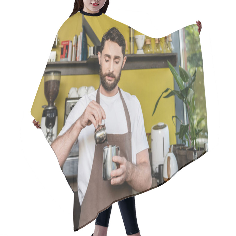 Personality  Bearded Barista In Apron Pouring Coffee In Metal Pitcher While Working In Cafe On Background Hair Cutting Cape