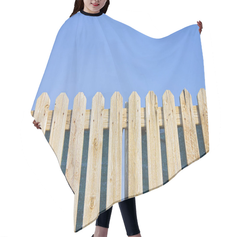 Personality  Detail Of A Wooden Fence Built With Spiky Wooden Boards Against A Blue Sky Hair Cutting Cape