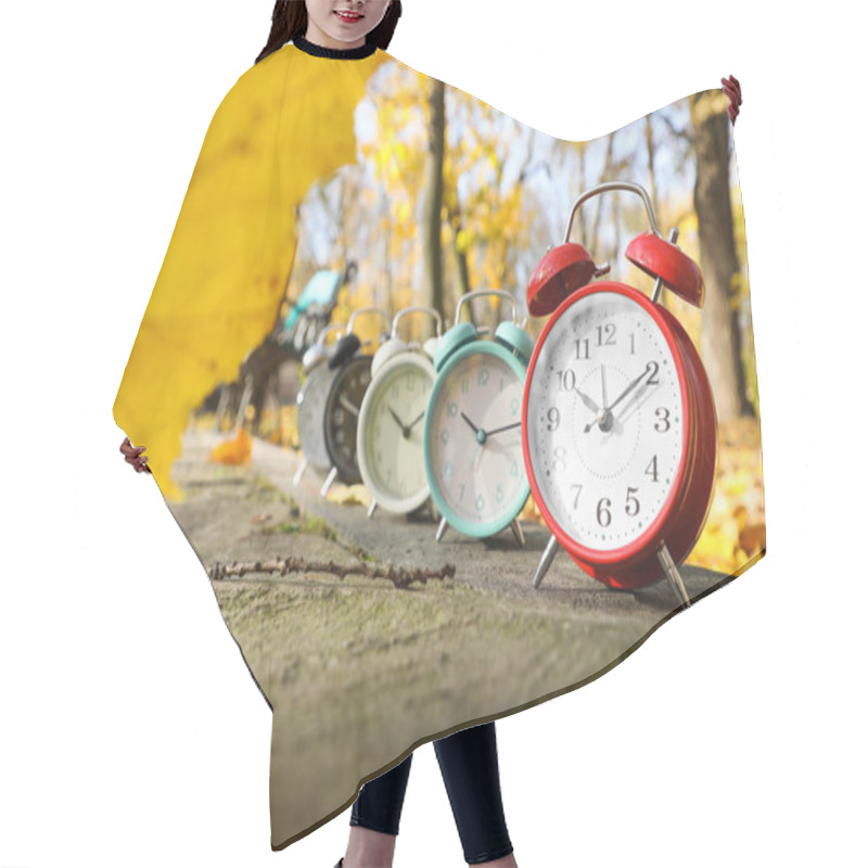 Personality  Alarm Clocks On Paved Pathway In Park At Autumn Hair Cutting Cape