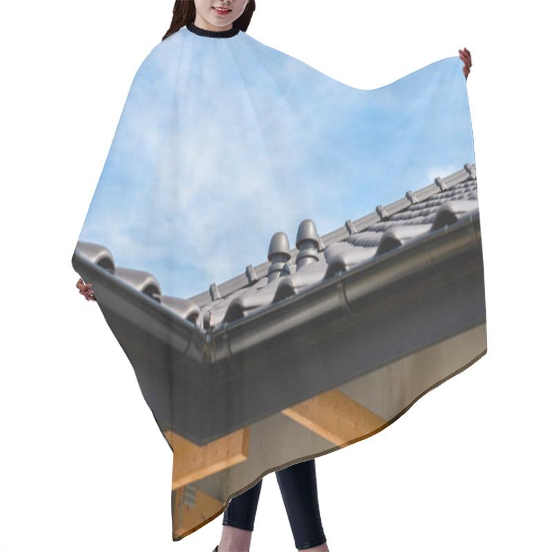 Personality  The Roof Of A Single-family House Covered With A New Ceramic Tile In Anthracite Against The Blue Sky, Visible Ceramic Ventilation Fireplace On The Roof. Hair Cutting Cape