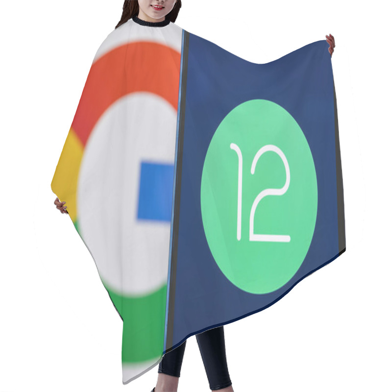 Personality  Kazan, Russia - May 29, 2021: Android Is A Mobile Operating System. The Twelfth Version Of The Android Operating System Developed By Google. Android 12 Logo On Smartphone Screen. Hair Cutting Cape