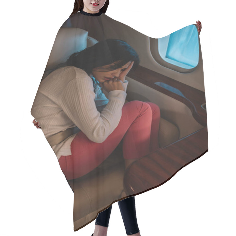 Personality  Overhead View Of Scared Woman With Airsickness Sitting In Private Jet  Hair Cutting Cape