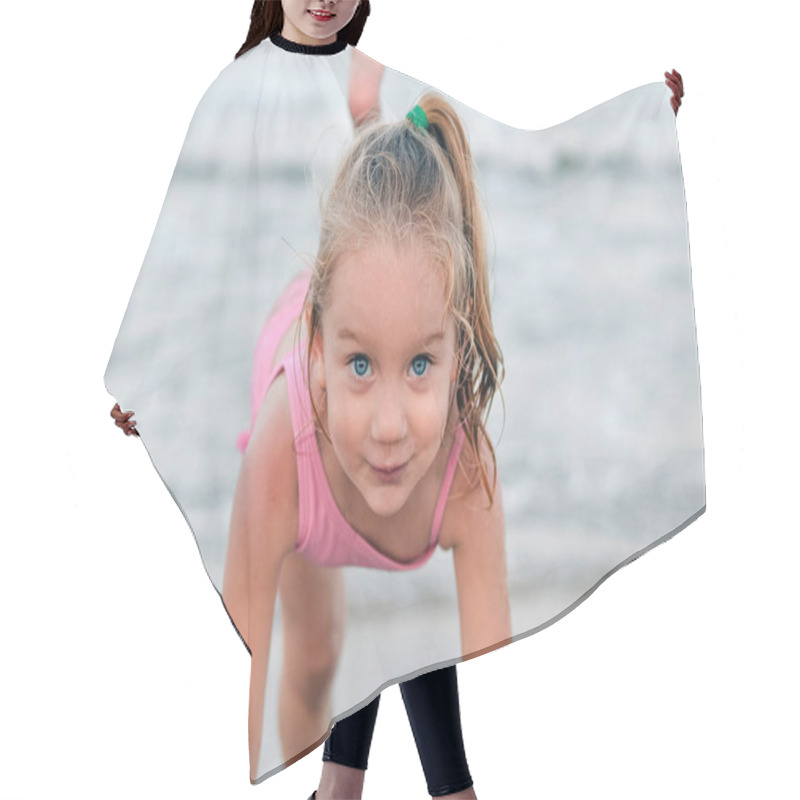 Personality  Little Happy And Smiling Girl Performs Gymnastic And Dance Exercises And Poses Against The Backdrop Of The Sea And Beach Hair Cutting Cape