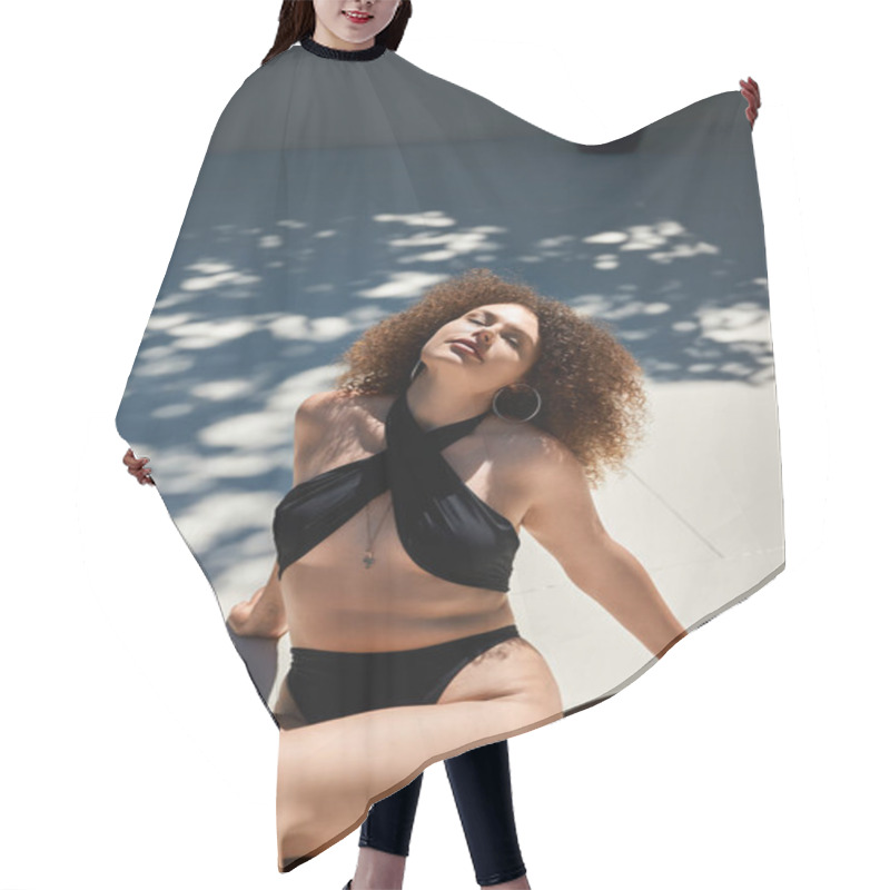 Personality  A Woman With Beautiful Curly Hair Relaxes In A Black Swimsuit On A Sunny Day. Hair Cutting Cape