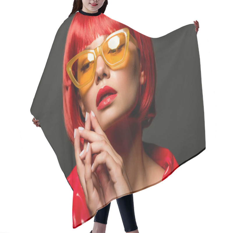 Personality  Close-up Portrait Of Stylish Young Woman In Red Latex Jacket And Vintage Yellow Sunglasses Isolated On Grey Hair Cutting Cape