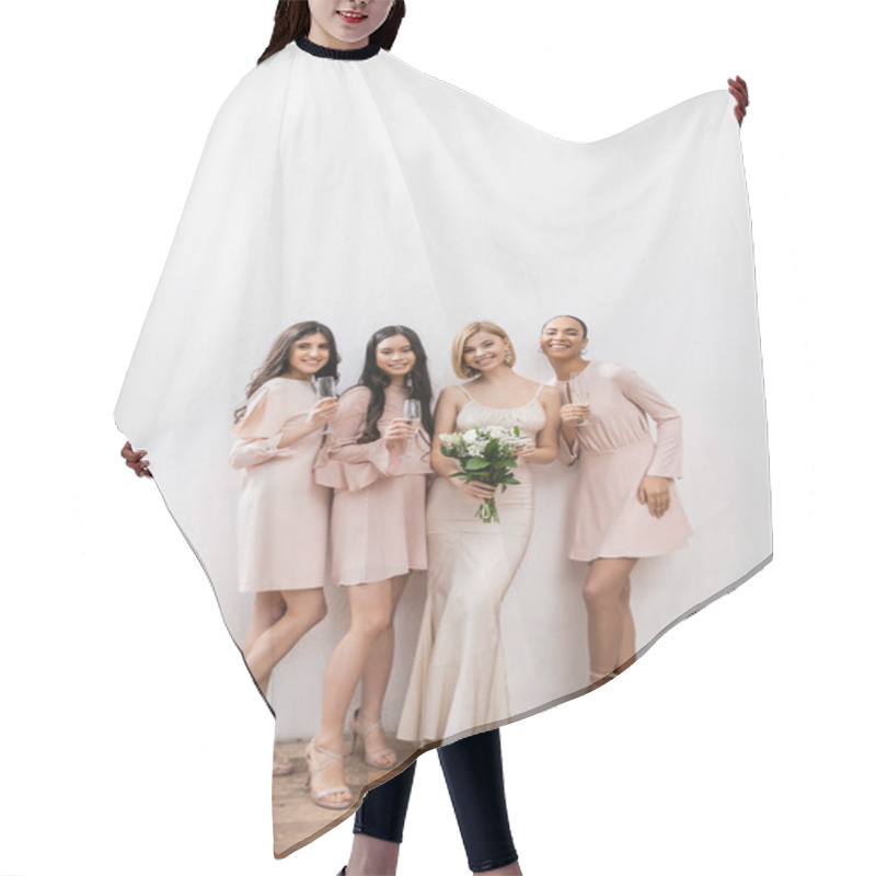 Personality  Positivity, Blonde Bride In Wedding Dress Holding Bouquet And Standing Near Interracial Bridesmaids With Champagne Glasses On Grey Background, Racial Diversity, Fashion, Multicultural Young Women  Hair Cutting Cape