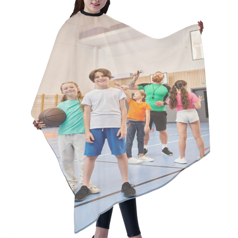 Personality  A Diverse Group Of Young Children Stand Confidently On Top Of A Basketball Court, Soaking In The Energy Of The Moment As They Listen Attentively To Their Male Teachers Instructions. Hair Cutting Cape