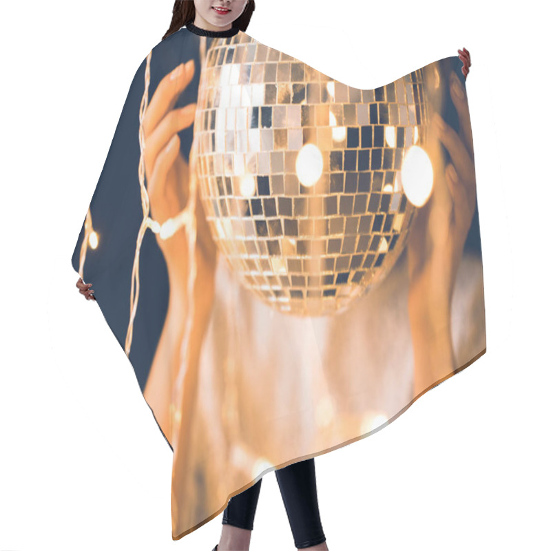 Personality  Close-up Shot Of Woman Touching Disco Ball With Beautiful Garlands Around Hair Cutting Cape