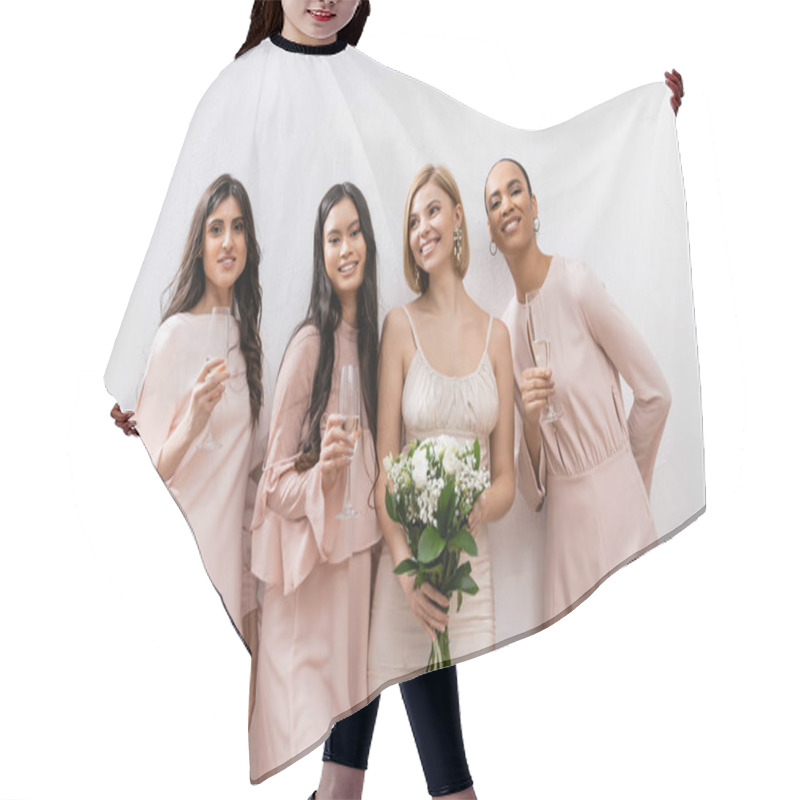 Personality  Positivity, Happy Bride In Wedding Dress Holding Bridal Bouquet And Standing Near Interracial Bridesmaids On Grey Background, Champagne Glasses, Racial Diversity, Fashion, Brunette And Blonde Women  Hair Cutting Cape