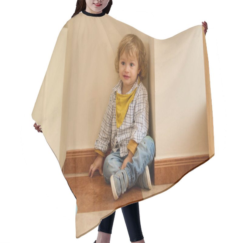 Personality  Young Child Indoors, Seated In A Corner, Joyfully Interacting. The Playful Environment And Casual Attire Evoke Innocence And Comfort. Hair Cutting Cape