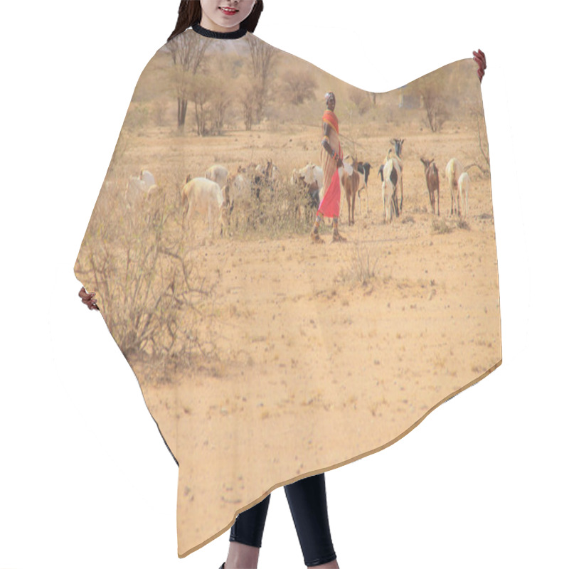 Personality  Marsabit, Kenya - January 16, 2015: African Female Shepherd From The Samburu Tribe (a Related Masai Tribe) In A National Costume Herding A Flock Of Goats Hair Cutting Cape